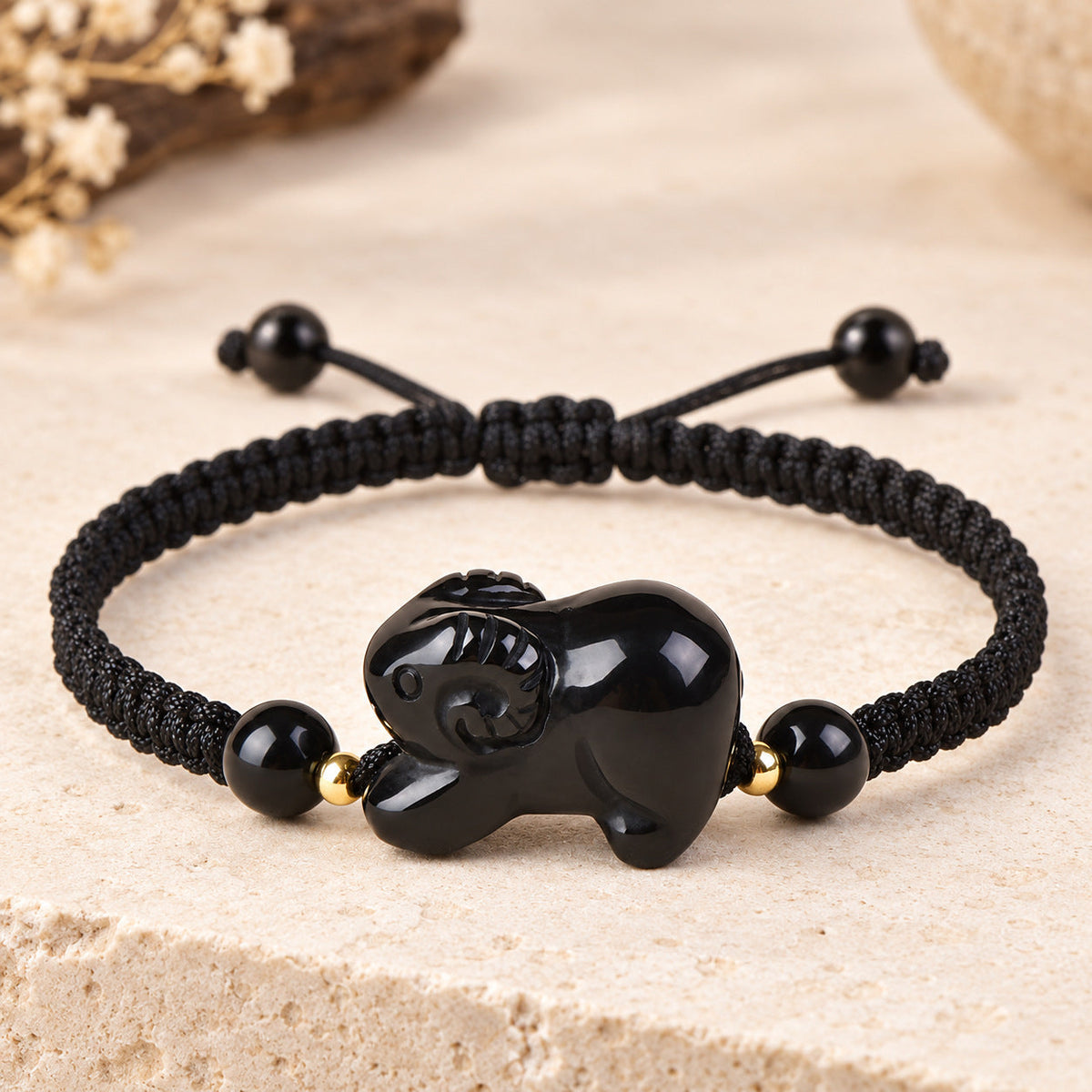 Black obsidian Goat zodiac carving on a braided cord bracelet