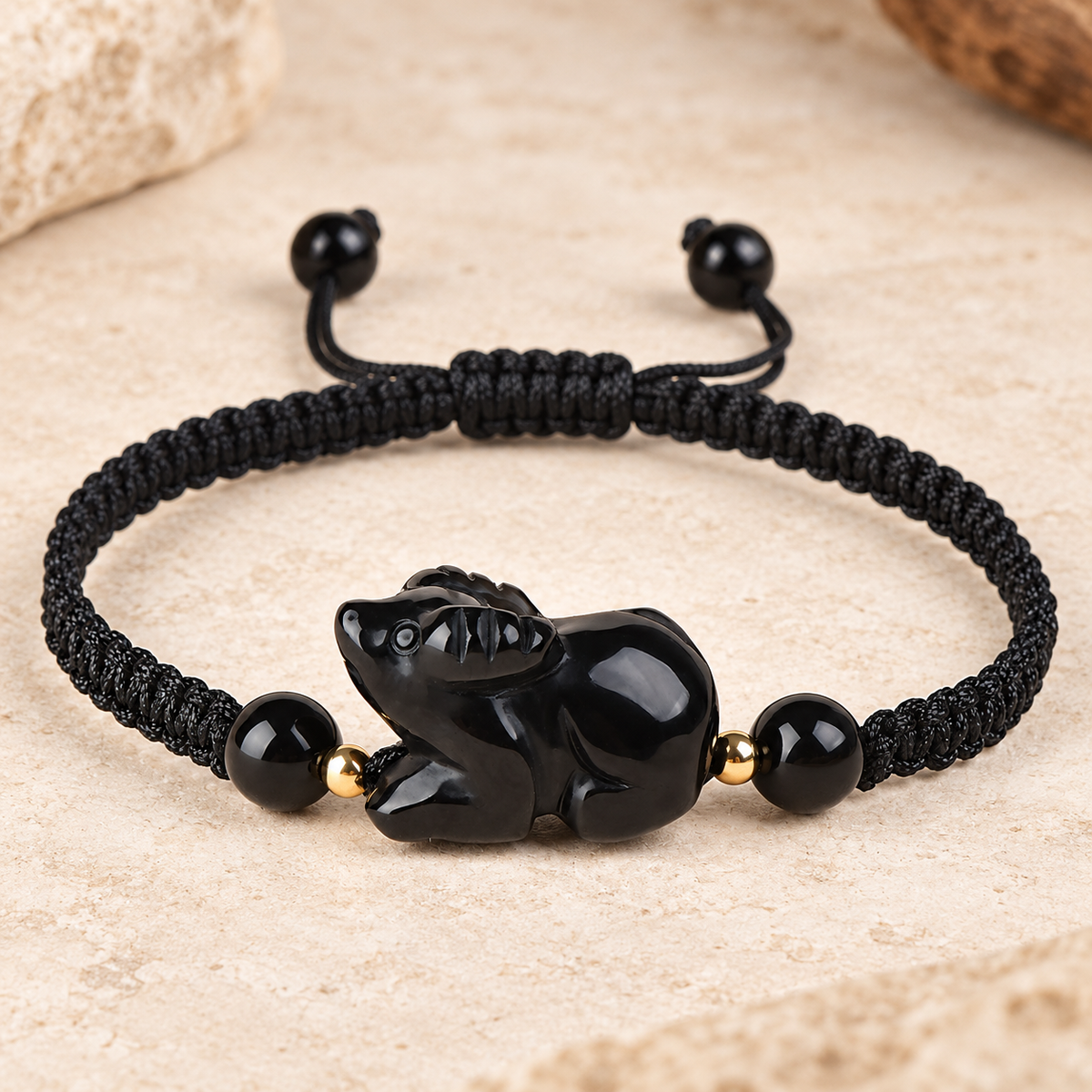 Black obsidian Ox zodiac carving on a braided cord bracelet