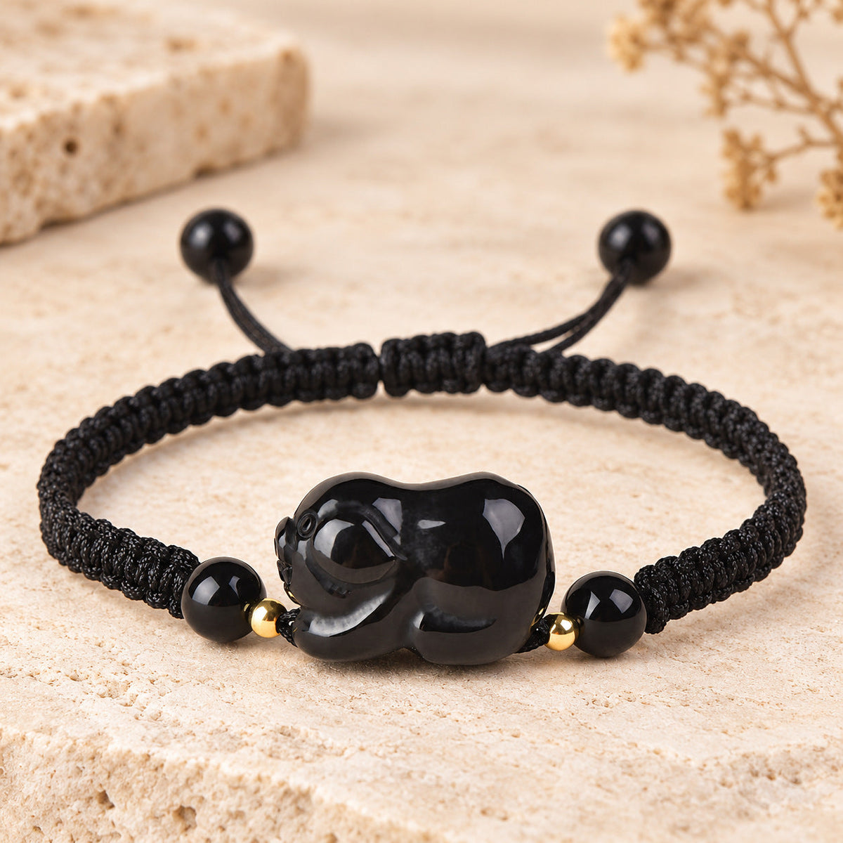 Black obsidian Pig zodiac carving on a braided cord bracelet