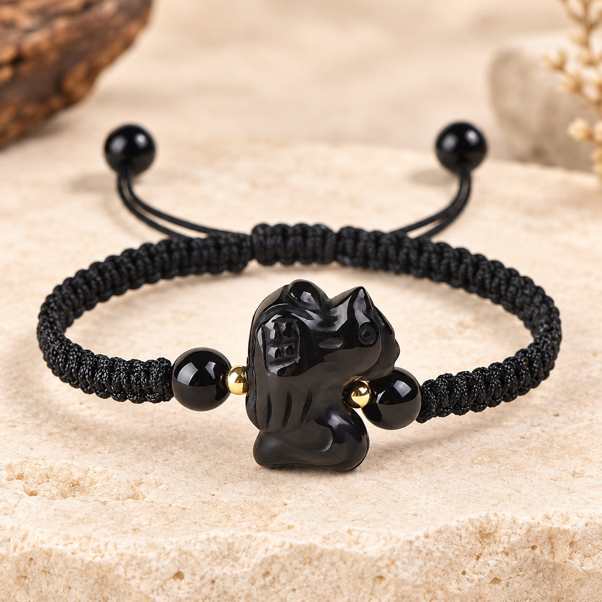 Black obsidian Rooster zodiac carving on a braided cord bracelet