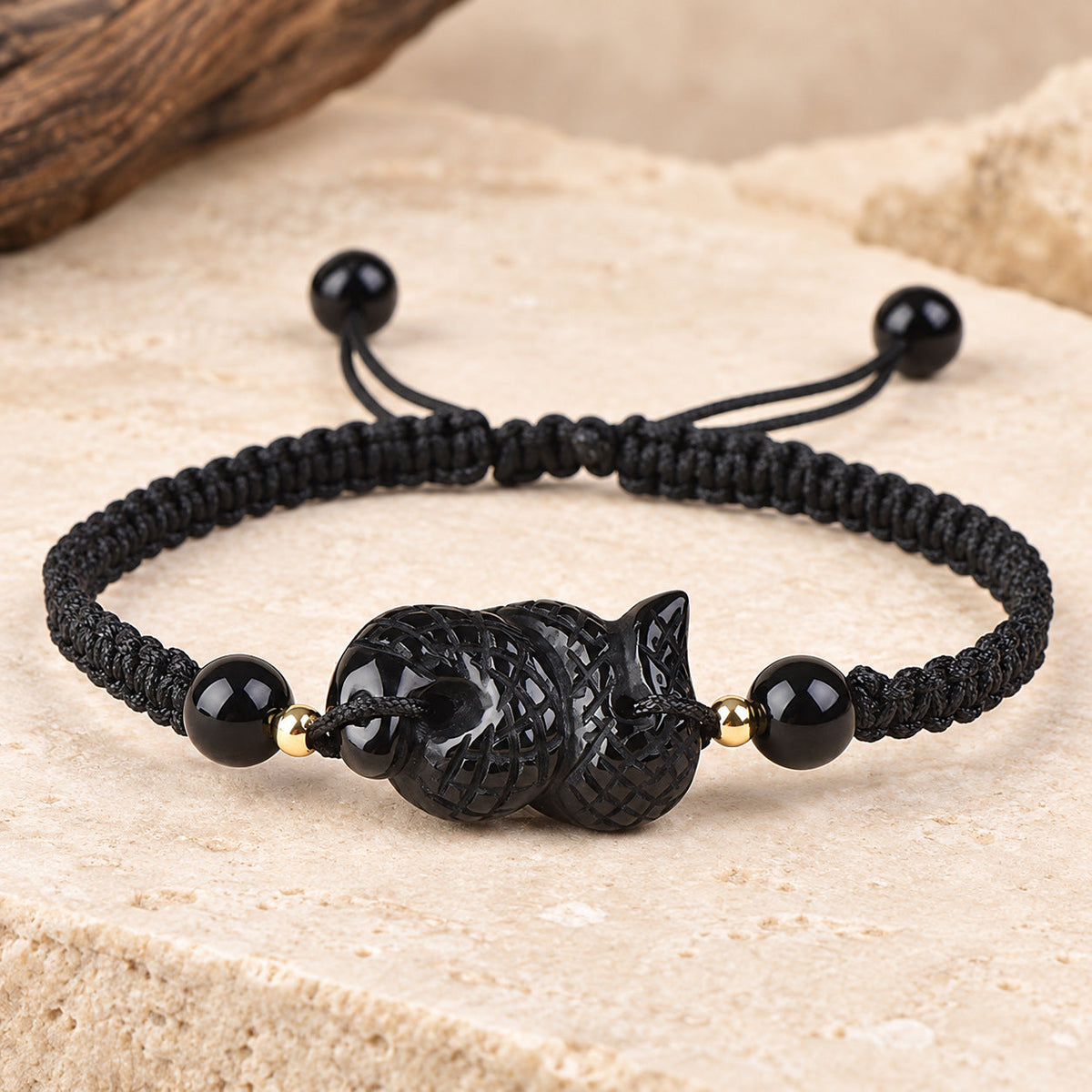 Black obsidian Snake zodiac carving on a braided cord bracelet