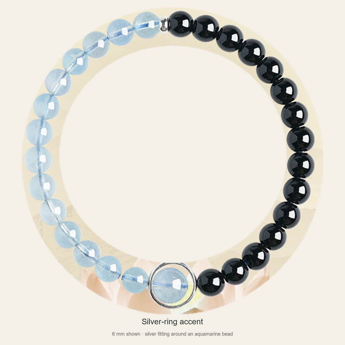Half aquamarine half obsidian bracelet with silver-ring accent, full view