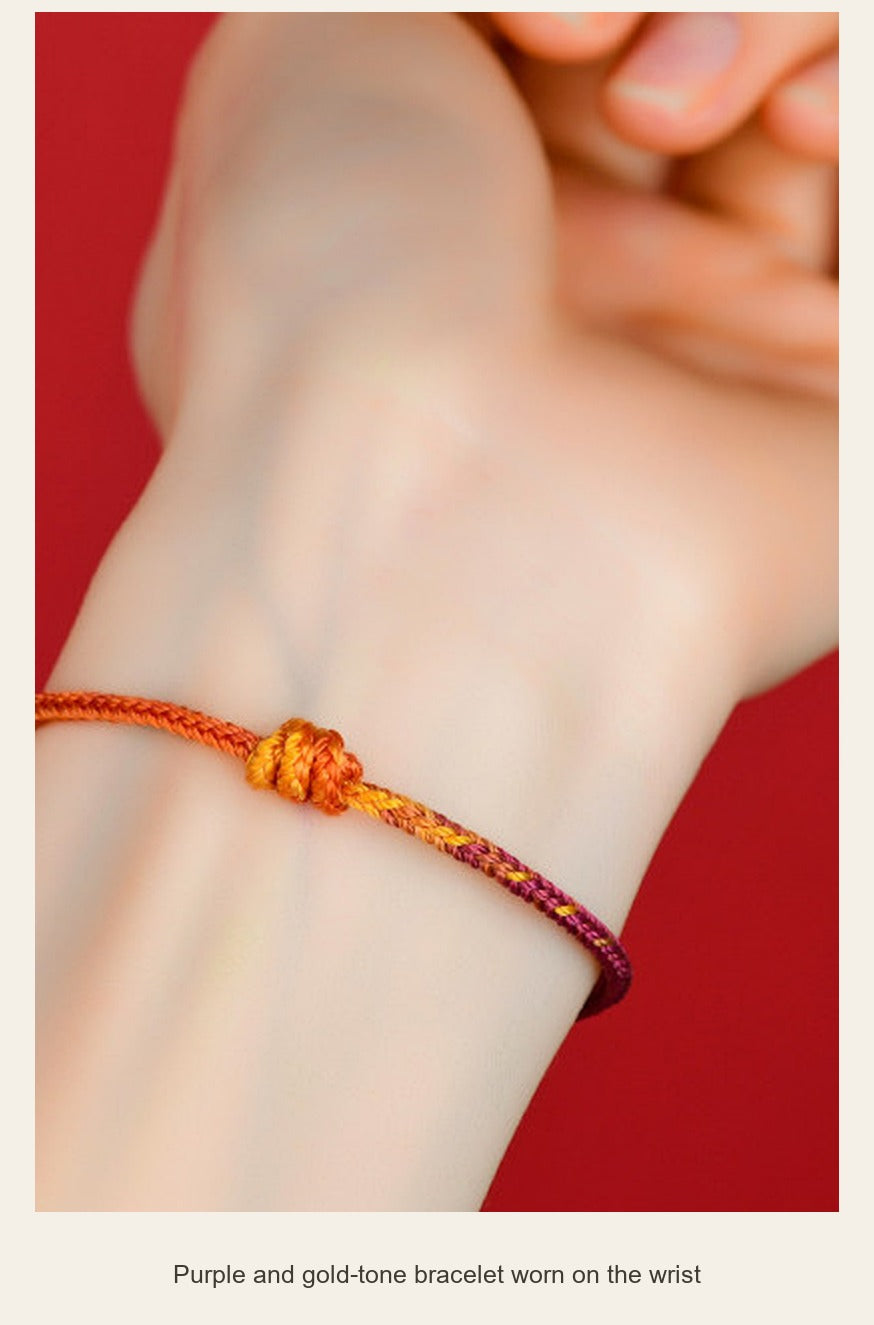 Braided Cord Bracelet — Red or Purple & Gold-Tone — purple and gold-tone bracelet worn on the wrist