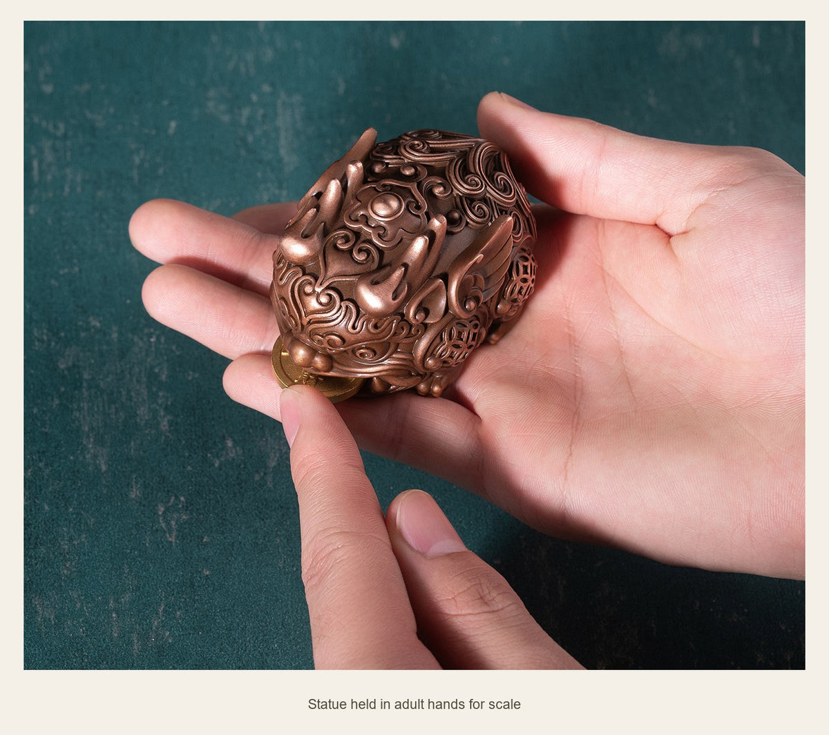 Copper Pixiu with Coin — 6.8 cm — statue held in adult hands for scale (Single statue)