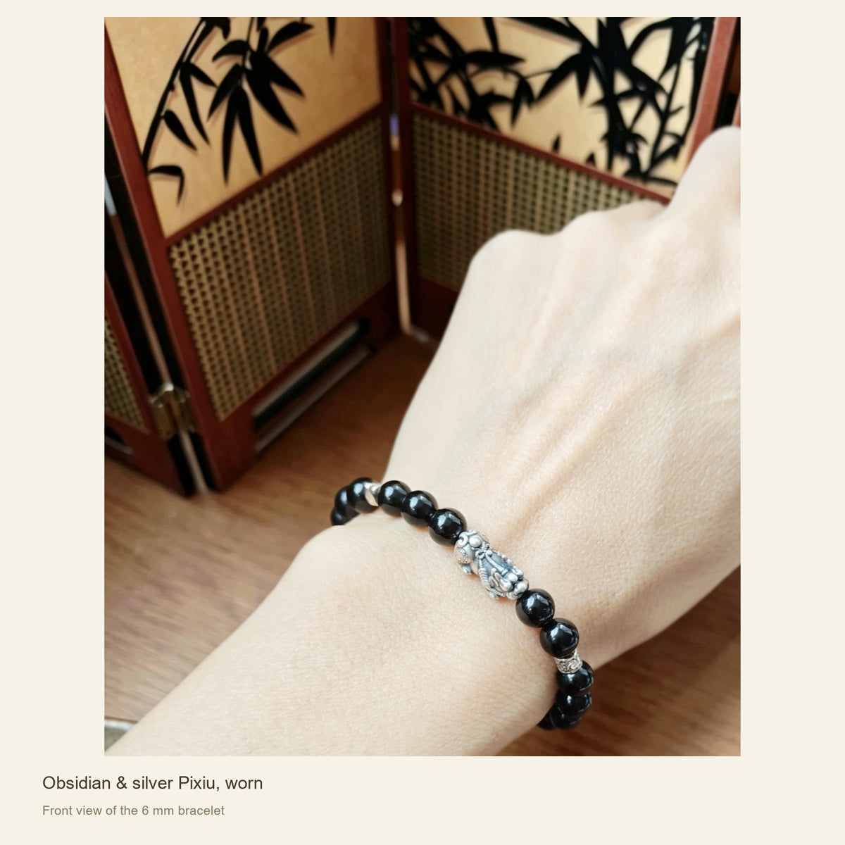 6 mm Obsidian & Fine Silver Pixiu Bracelet — Obsidian & silver Pixiu, worn; Front view of the 6 mm bracelet