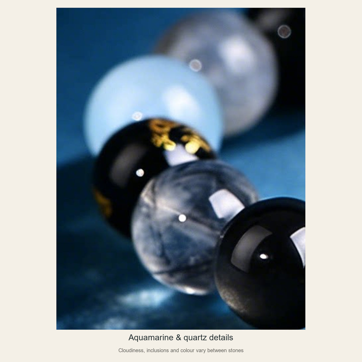 Aquamarine and black-inclusion quartz bead texture close-up