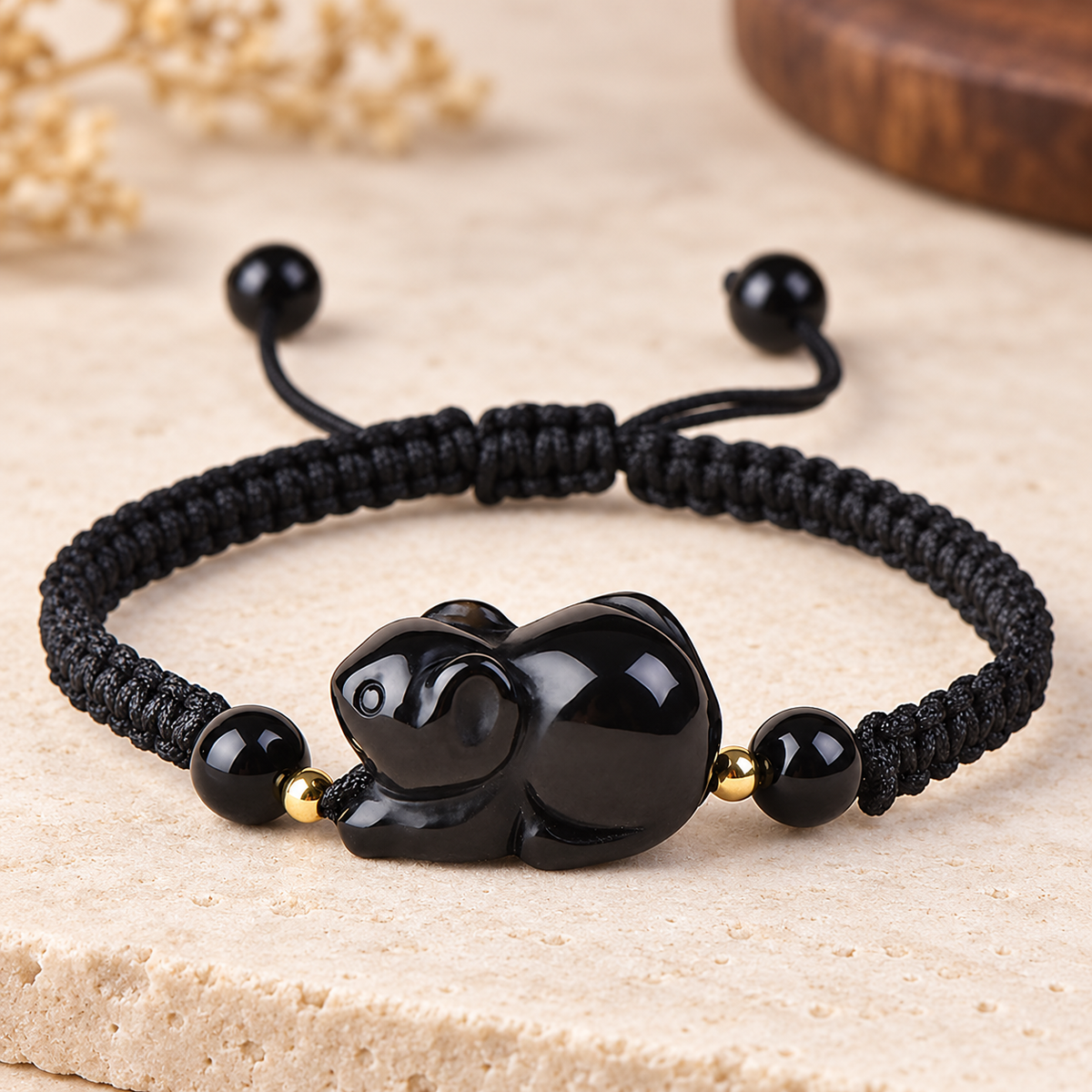 Black obsidian Rat zodiac carving on a braided cord bracelet