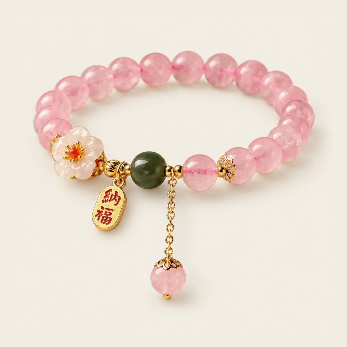 Pink crystal and jade bracelet with floral and gold-tone accents