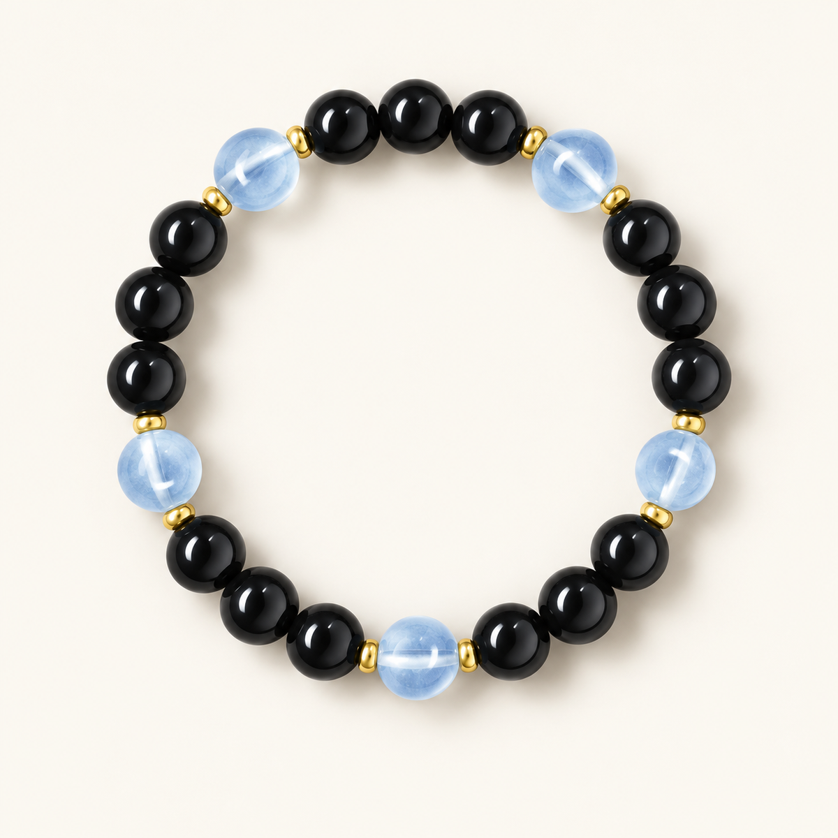 Aquamarine & Obsidian Calming Bracelet on an ivory background