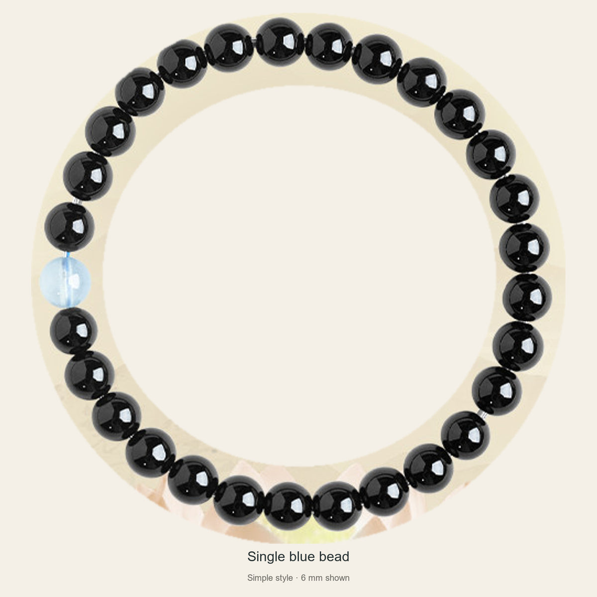 Black obsidian bracelet with one aquamarine accent, full view