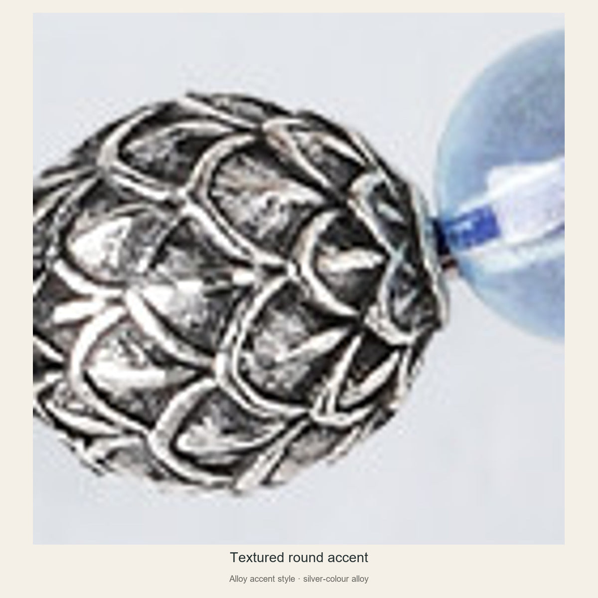 Textured round alloy spacer close-up