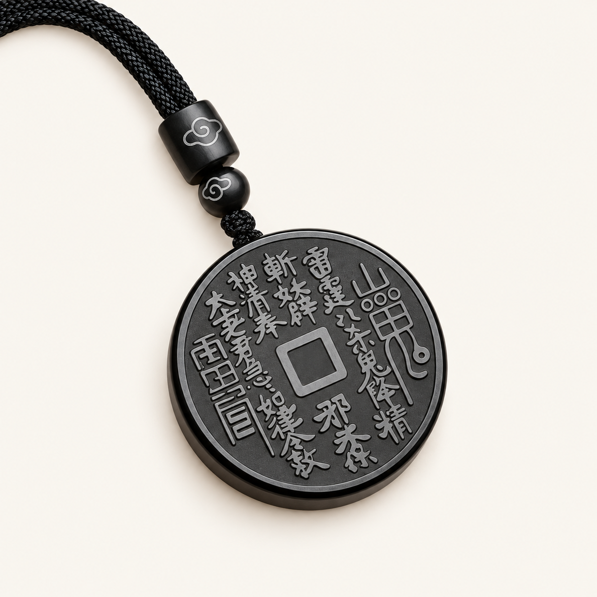 Black Obsidian Mountain Coin Pendant on an ivory background