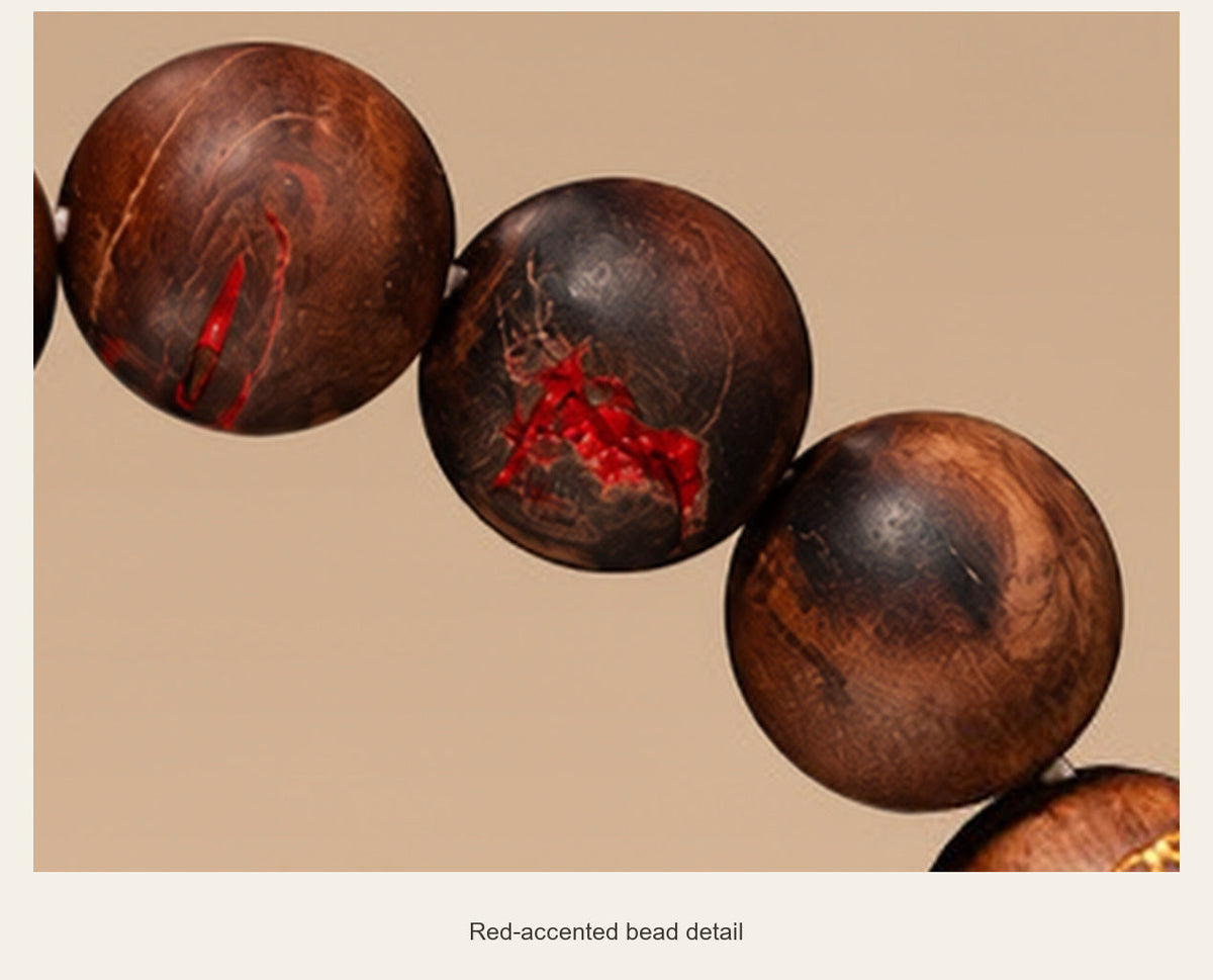 Carved Jujube Wood Bracelet — 10 mm Beads — red-accented bead detail