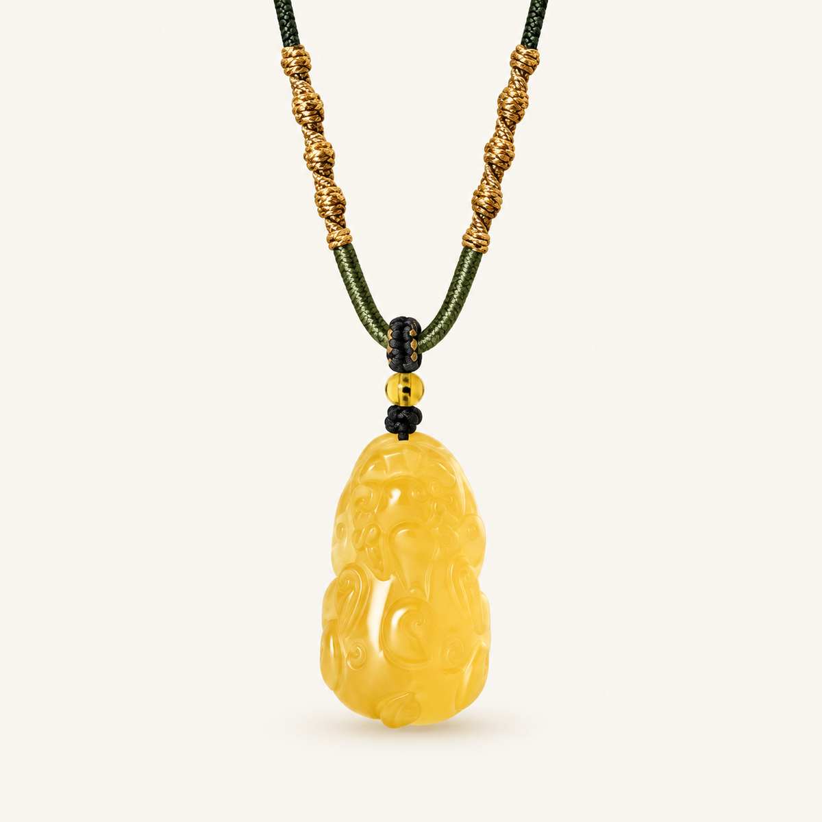 Citrine Pixiu Prosperity Pendant on an ivory background