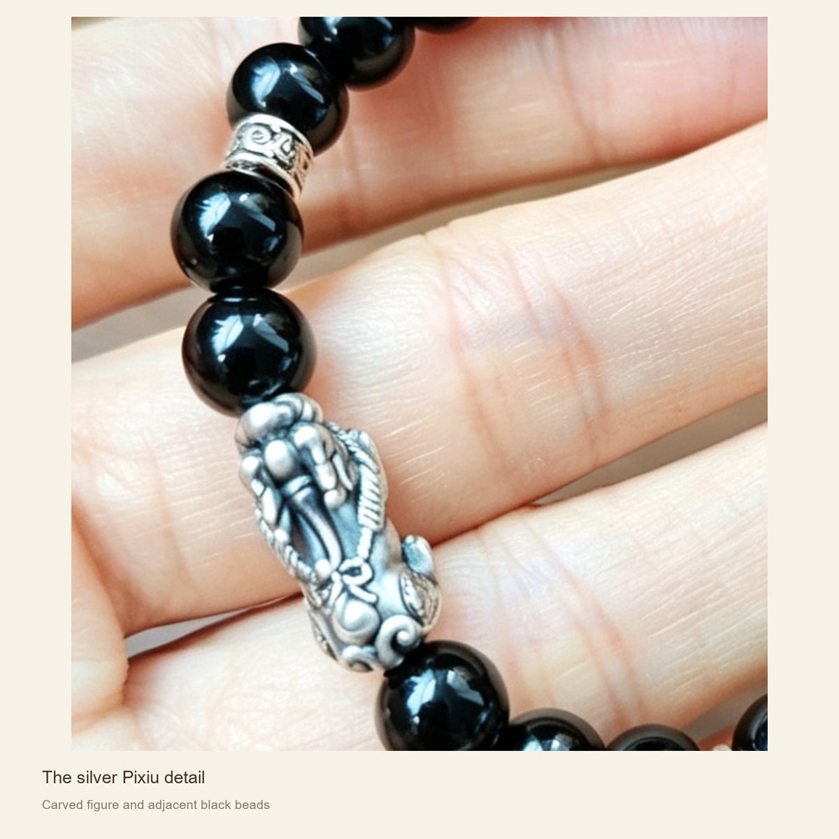 6 mm Obsidian & Fine Silver Pixiu Bracelet — The silver Pixiu detail; Carved figure and adjacent black beads