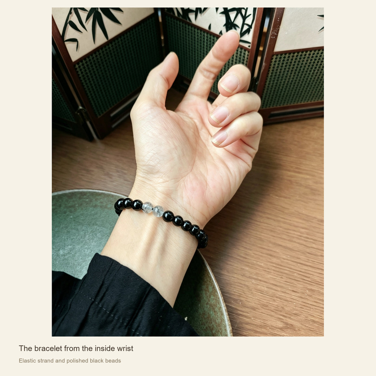 6 mm Obsidian & Fine Silver Pixiu Bracelet — The bracelet from the inside wrist; Elastic strand and polished black beads