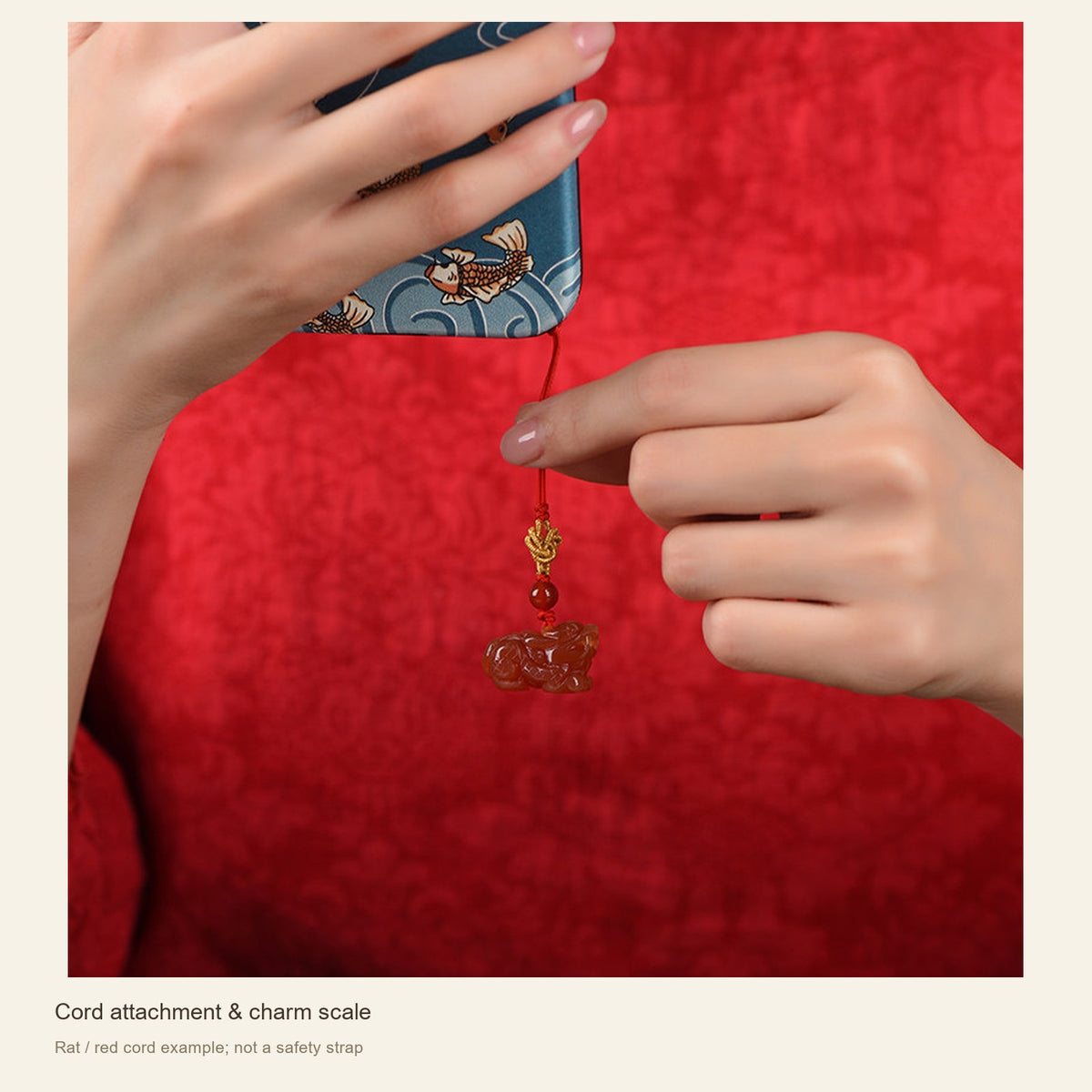 Red Agate Chinese Zodiac Phone Charm — Cord attachment & charm scale; Rat / red cord example; not a safety strap