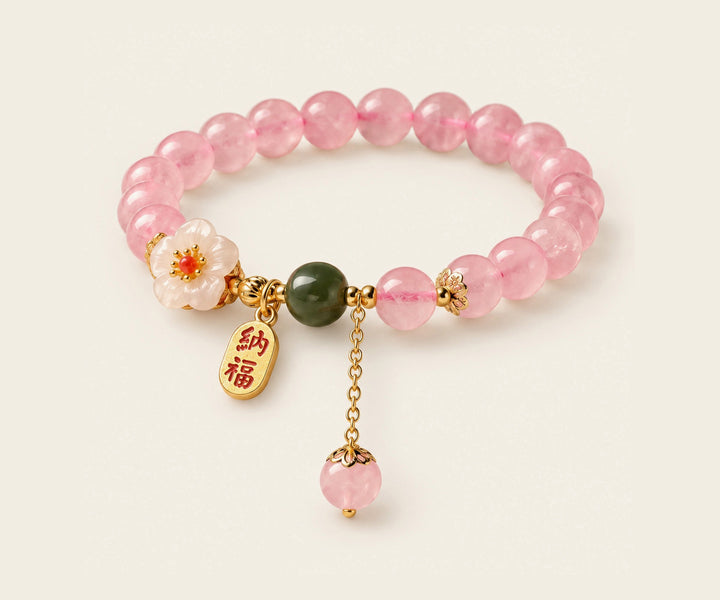 Pink crystal bracelet with floral and jade accents