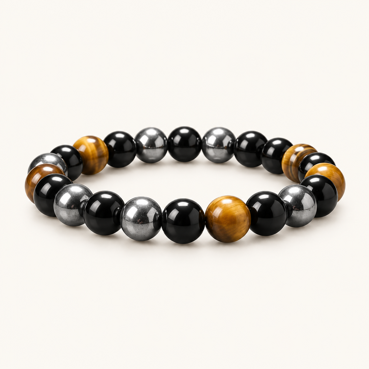 Obsidian & Tiger Eye Energy Bracelet on an ivory background
