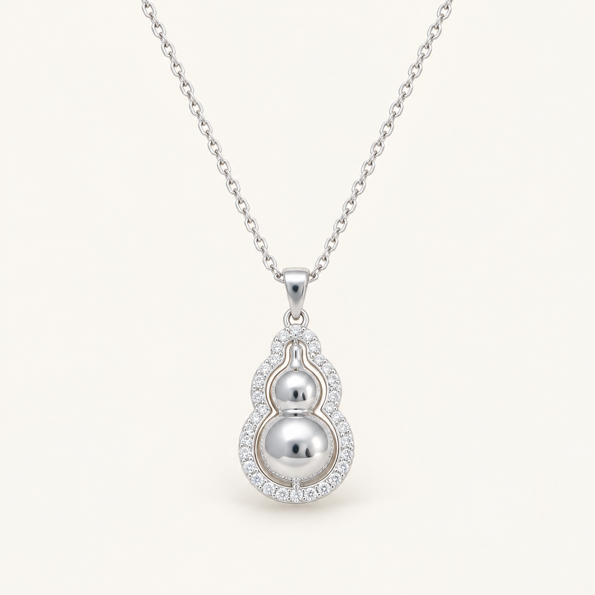 Silver Gourd Feng Shui Necklace on an ivory background
