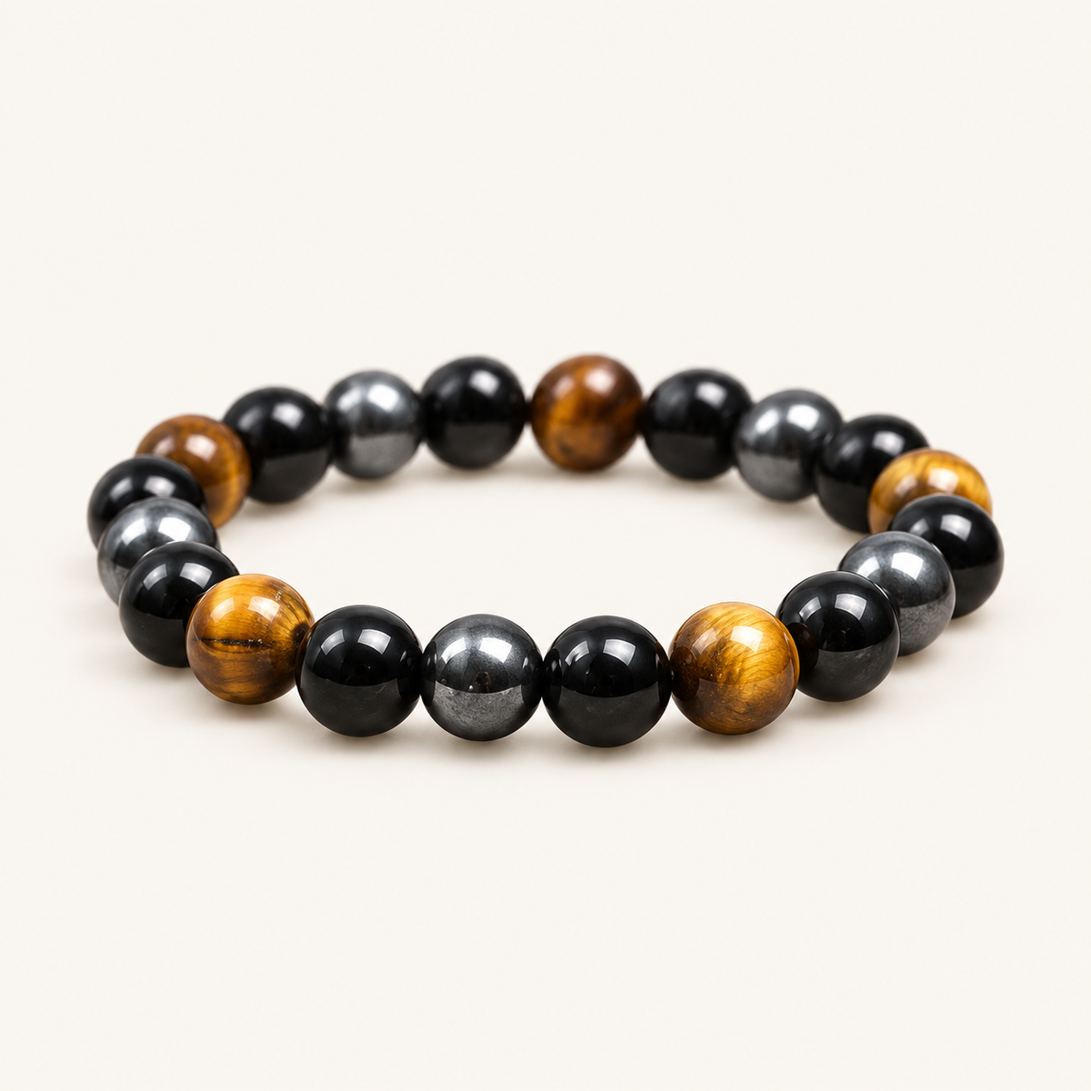 Tiger Eye & Obsidian Earth Bracelet on an ivory background